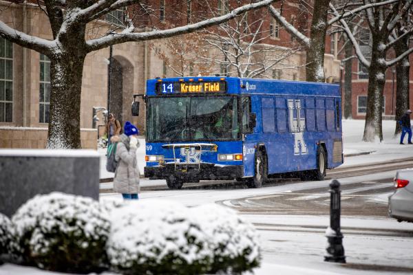 Bus going through campus in the winter