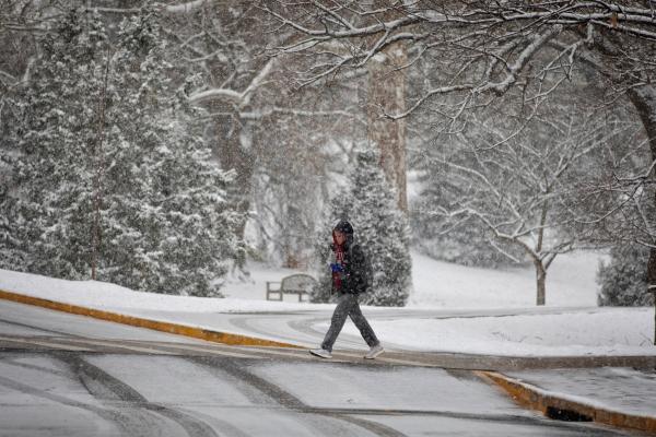 Student walking in the snow