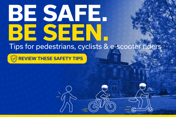 Graphic of a blue background of a building with text in white reading "Be Safe." and yellow text reading "Be Seen. Tips for pedestrians, cyclists & e-scooter riders" with a yellow button that says "Review these safety tips" with icons of a pedestrian, cyclists, and scooter rider.