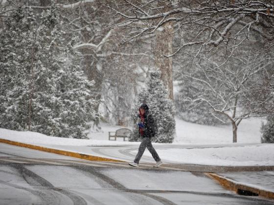 Student walking in the snow